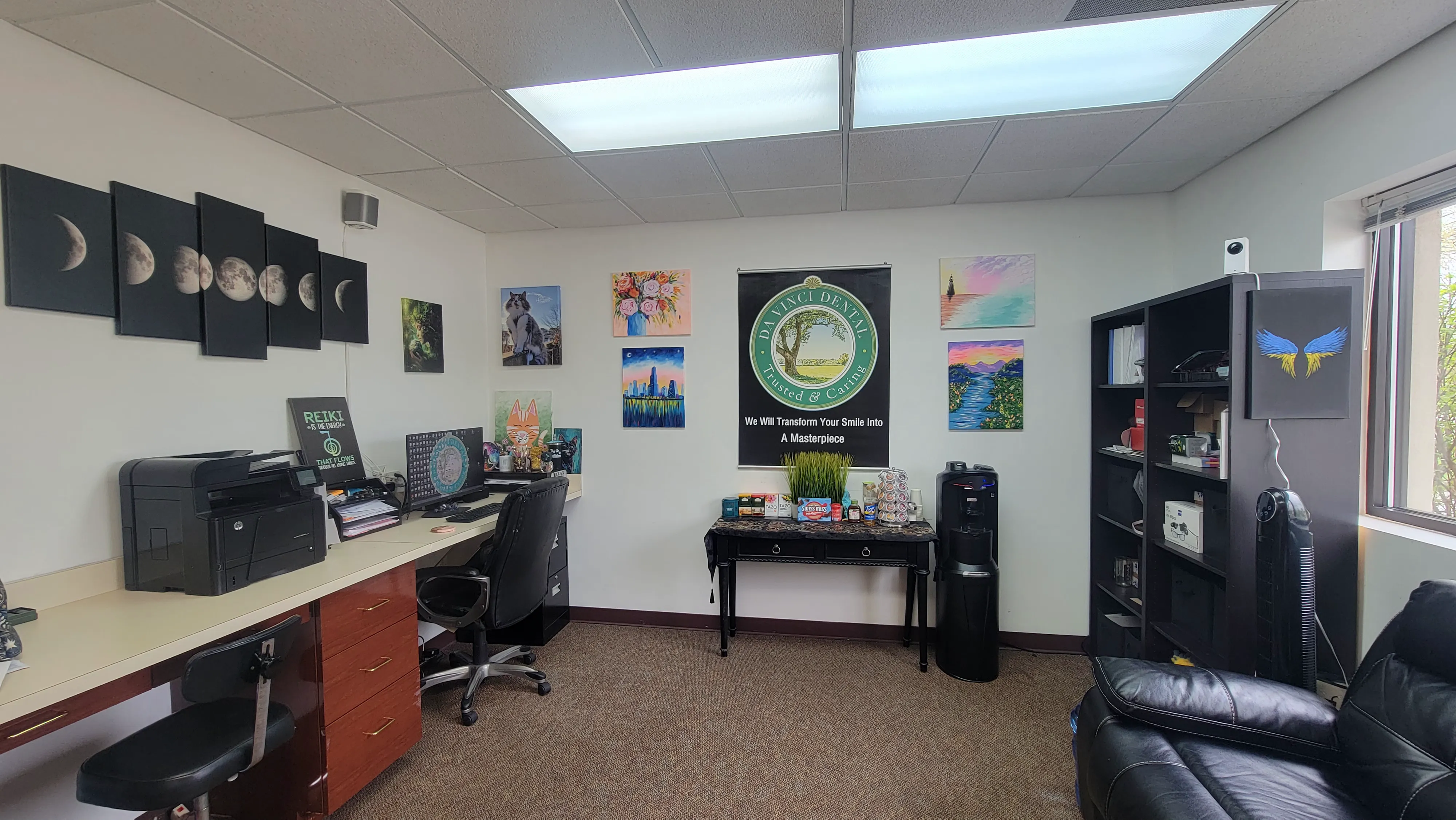 Art wall with moon phases and paintings
